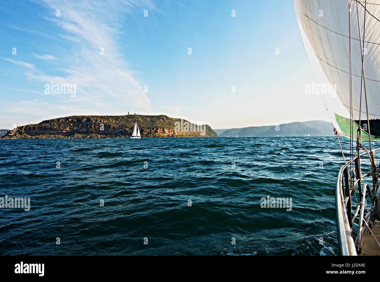 Cruising Sailing Yacht, under sail, at sea heading to the safe harbour of Broken Bay, New South