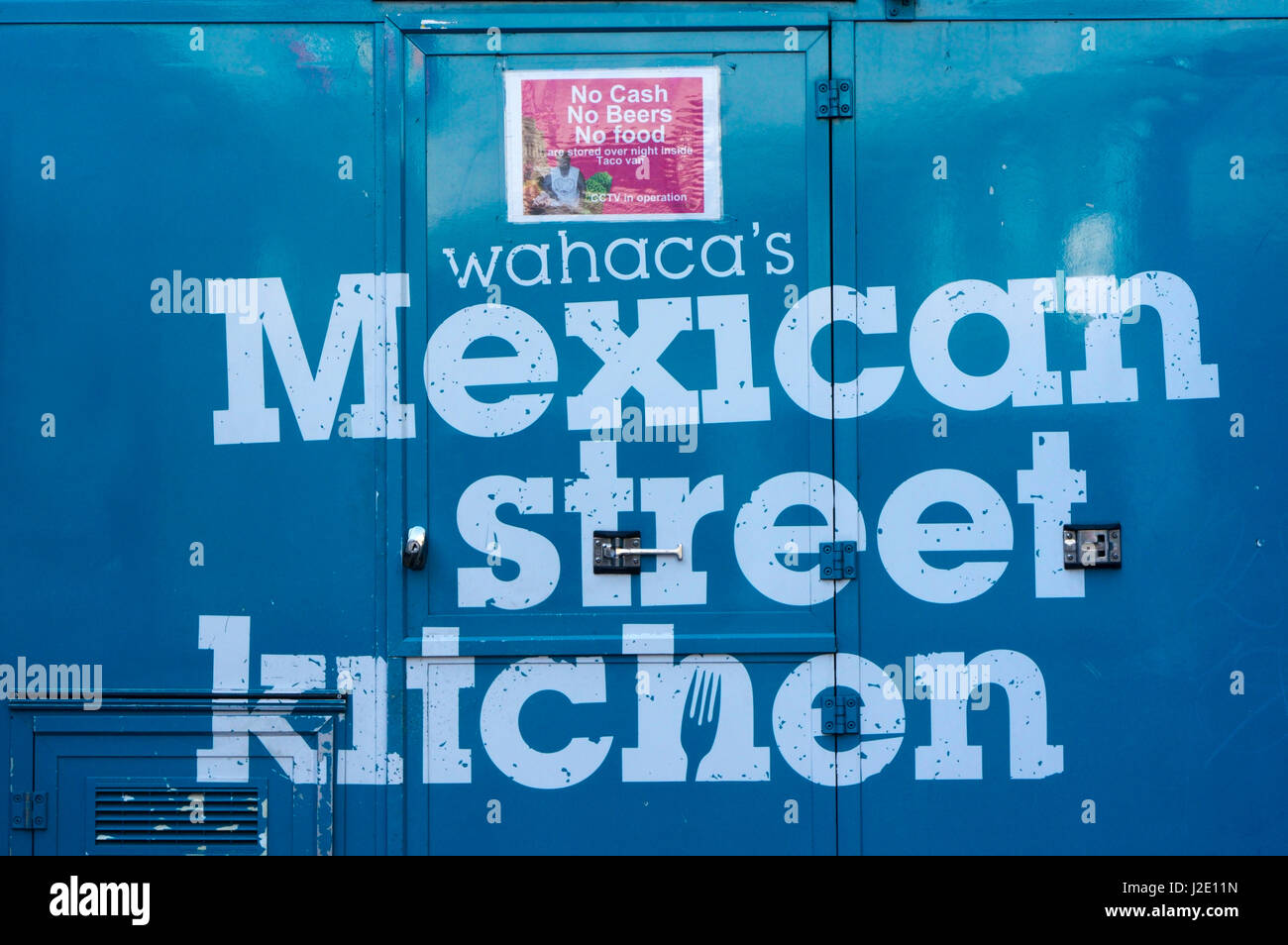 A sign for Wahaca's Mexican Street Kitchen on one of eight recycled shipping containers housing Wahaca restaurant on London's South Bank. Stock Photo