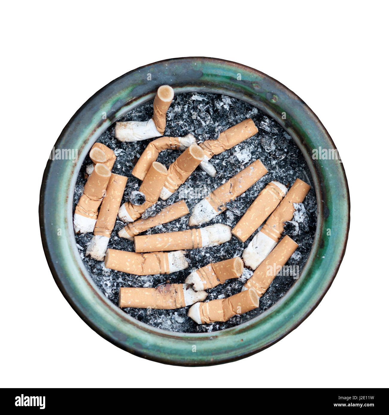 A circular ashtray full of old cigarette stubs. Stock Photo