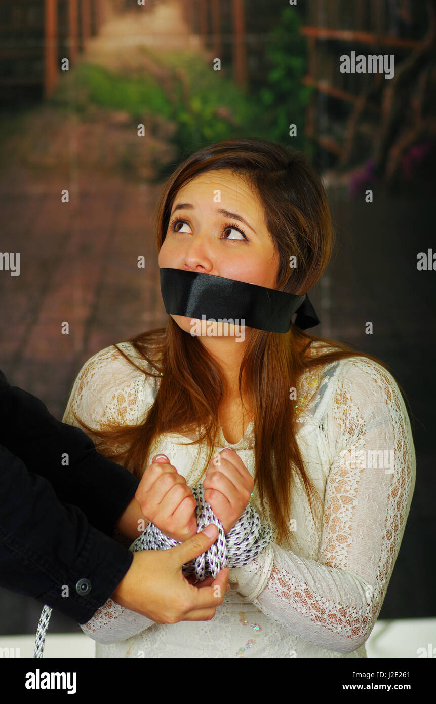 Terrified young girl kidnapped and bonded Stock Photo - Alamy