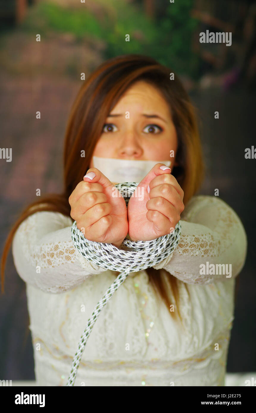 Terrified young girl kidnapped and bonded Stock Photo Alamy