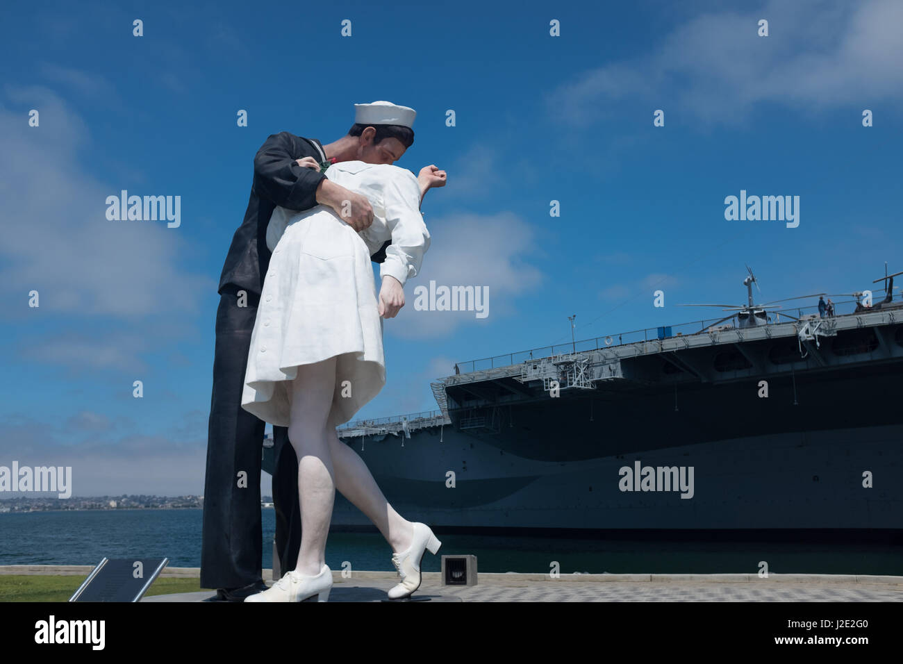 "Unconditional Surrender" sculpture, by Seward Johnson, and USS Midway