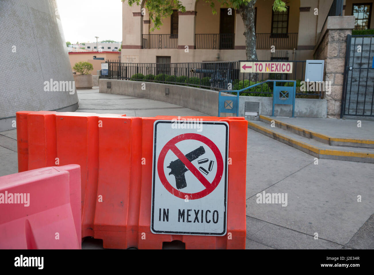 Nogales, Arizona - A sign at the pedestrian border crossing warns that taking guns and ammunition to Mexico is prohibited. Stock Photo