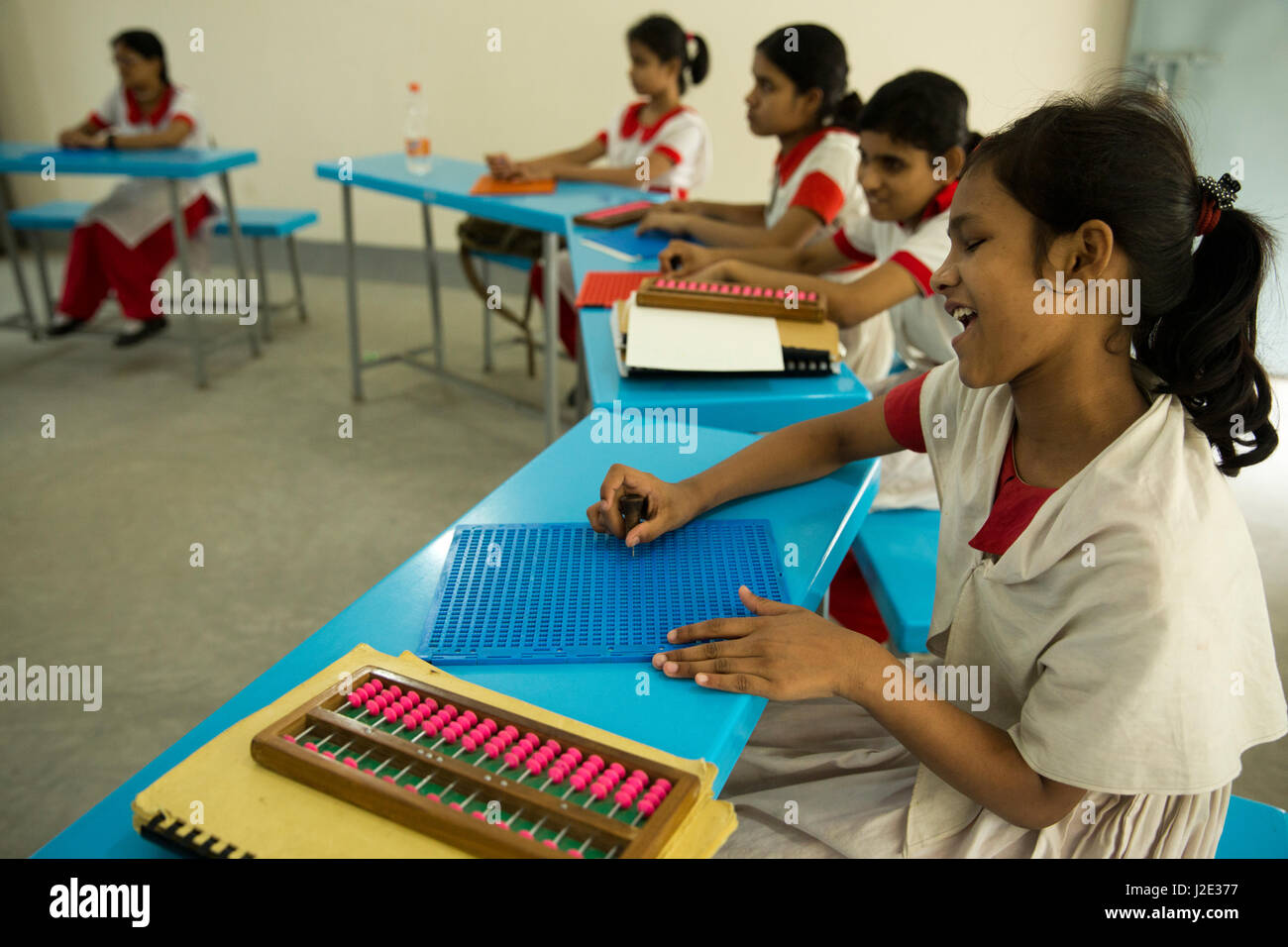 Visually impaired girl students learn in classroom with the help of Bangla braille at the