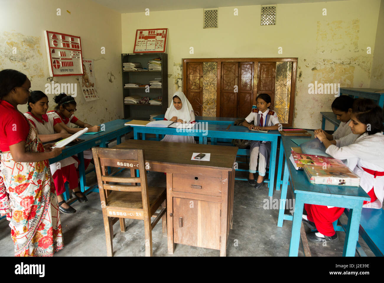 Visually impaired girl students learn in classroom with the help of