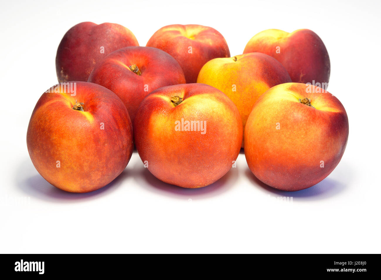 sweet freshness of nectarines, peach isolated on white background Stock