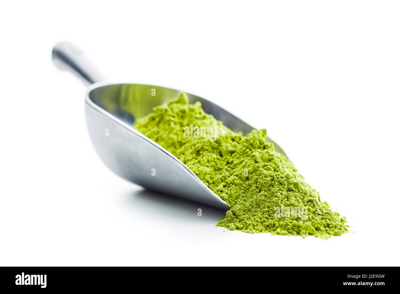 Green matcha tea powder in scoop isolated on white background Stock ...
