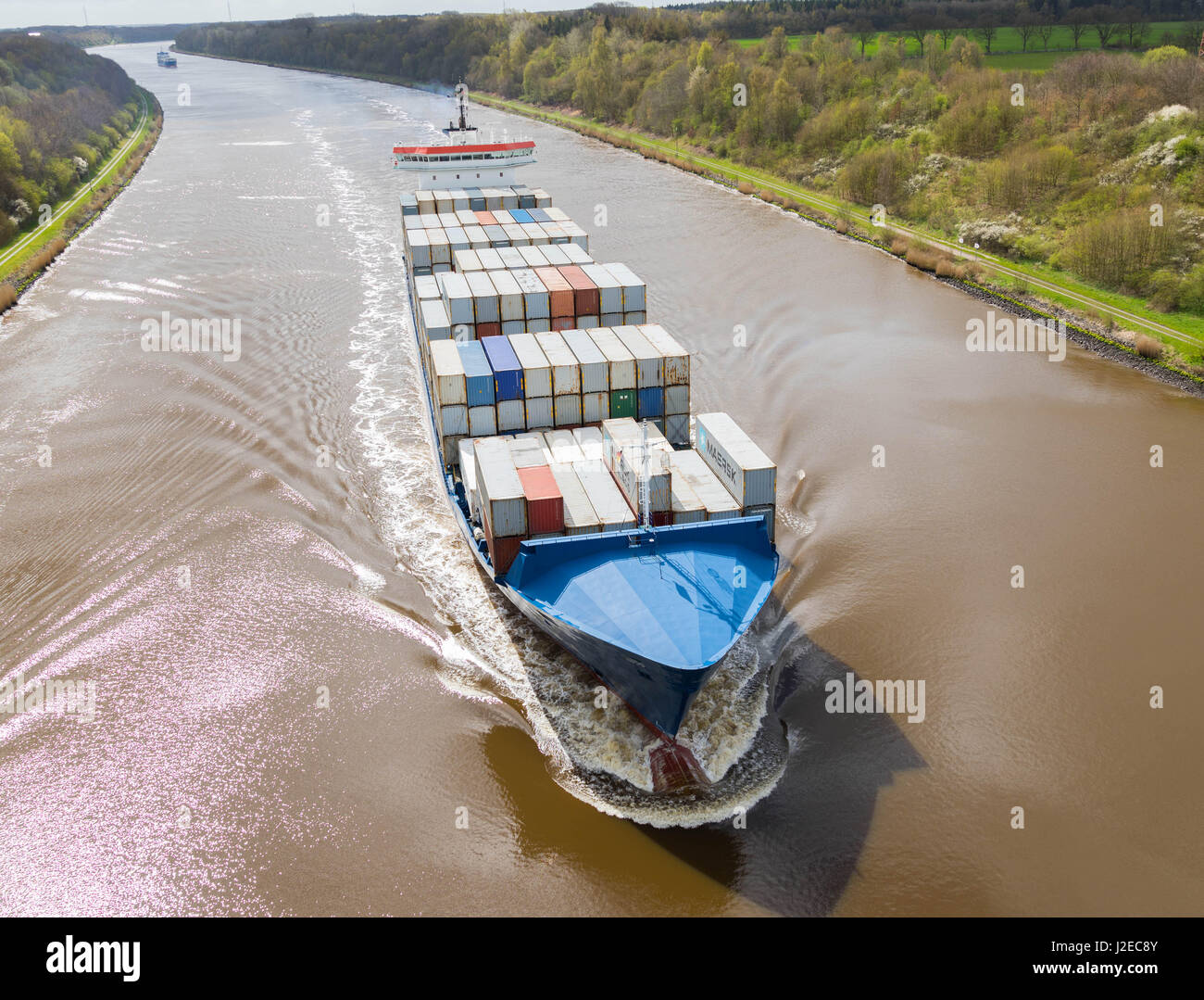Albersdorf, Germany, April 15, 2017, Container ship 'WES AMELIE' in the North Sea Baltic Canal, in german language Nord - Ostsee Kanal Stock Photo