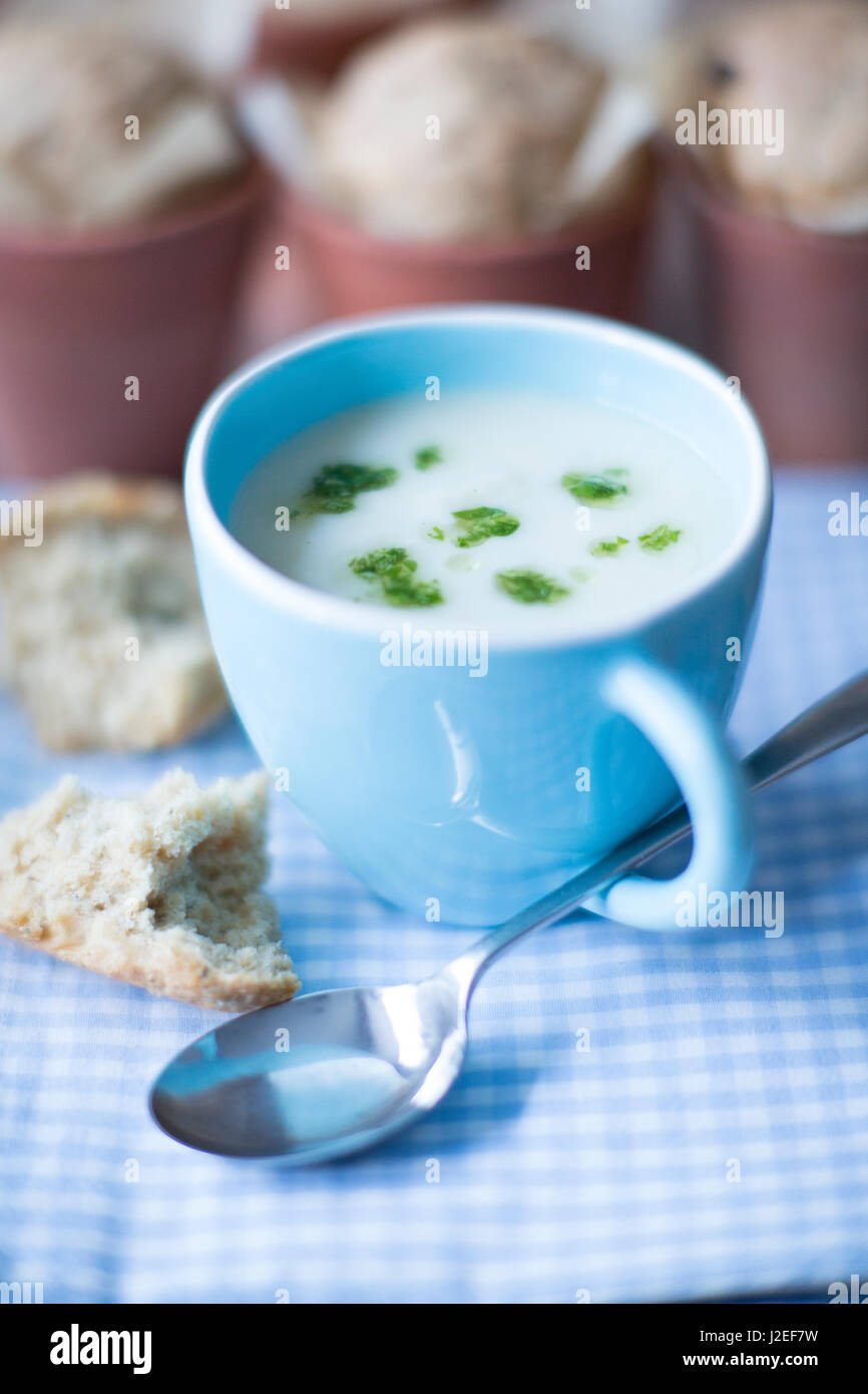 Cup of celeriac soup with parmesan flowerpot bread Stock Photo
