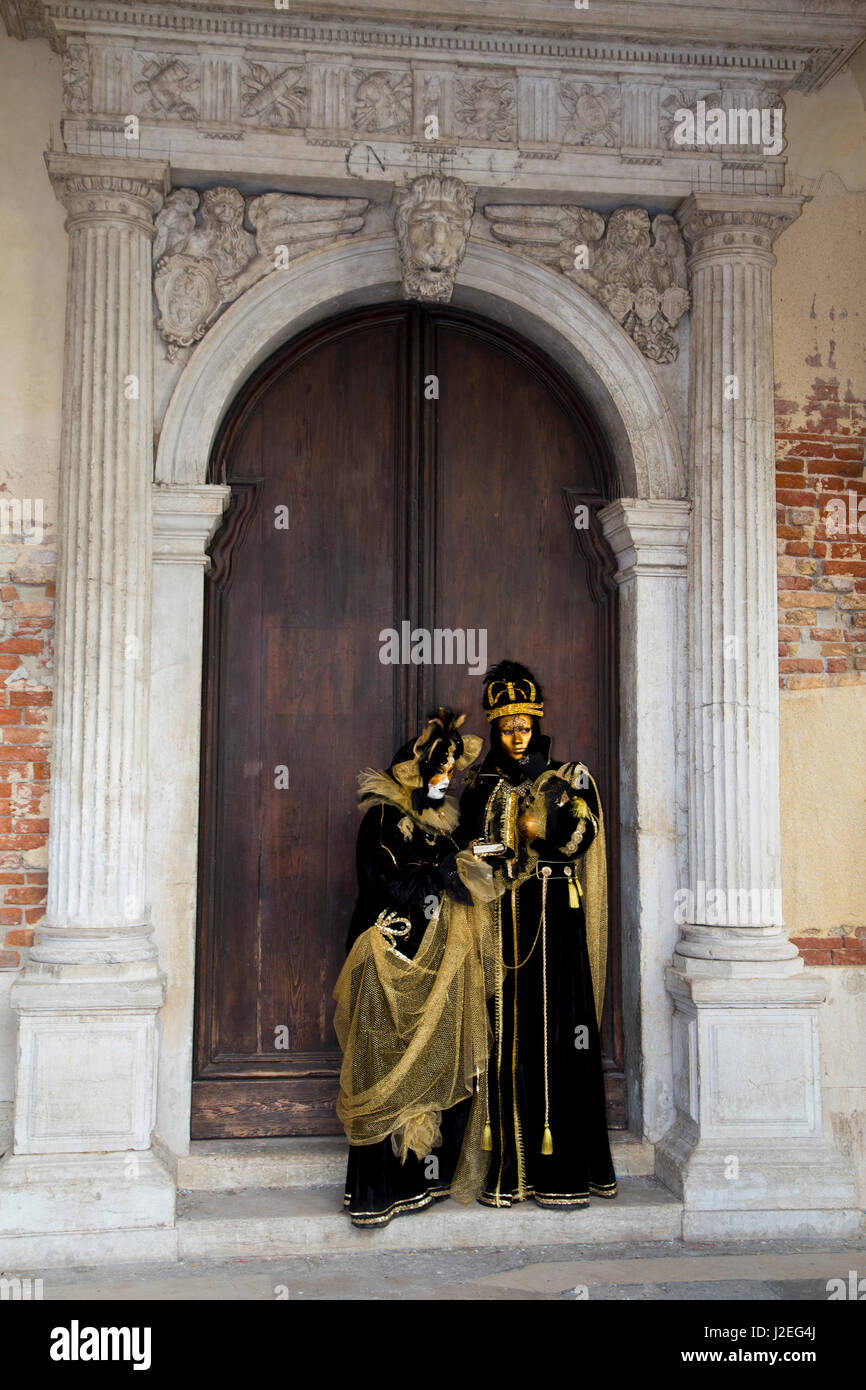 Venice, Italy. Carnival, couple in costume in doorway Stock Photo