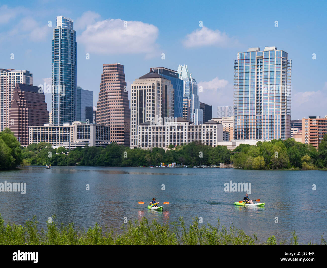 Skyline and kayaks from the Boardwalk Trail at Lady Bird Lake, Austin