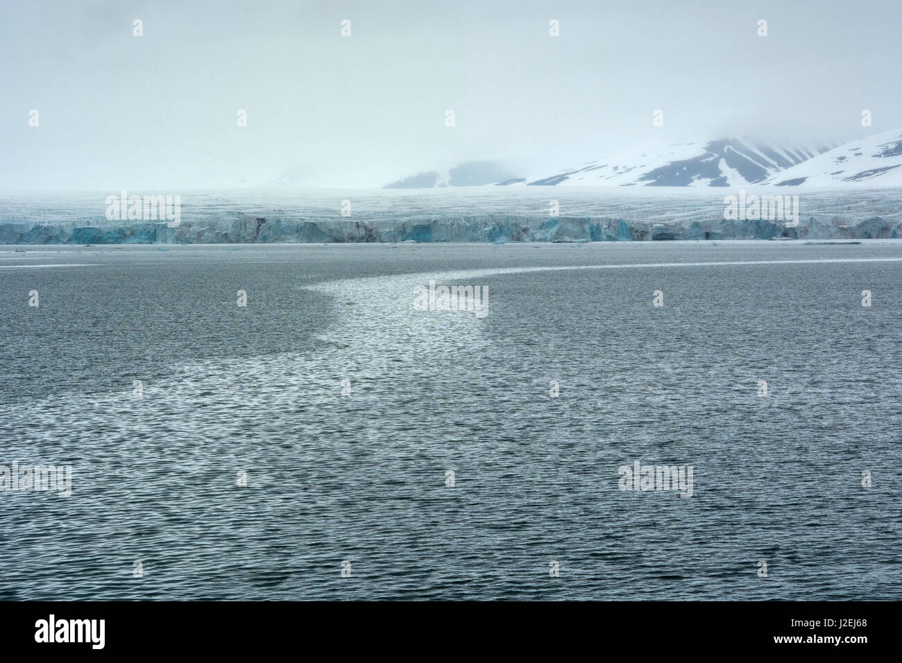 Norway. Svalbard. Hornsund. Currents in the water and a glacier in the background. Stock Photo