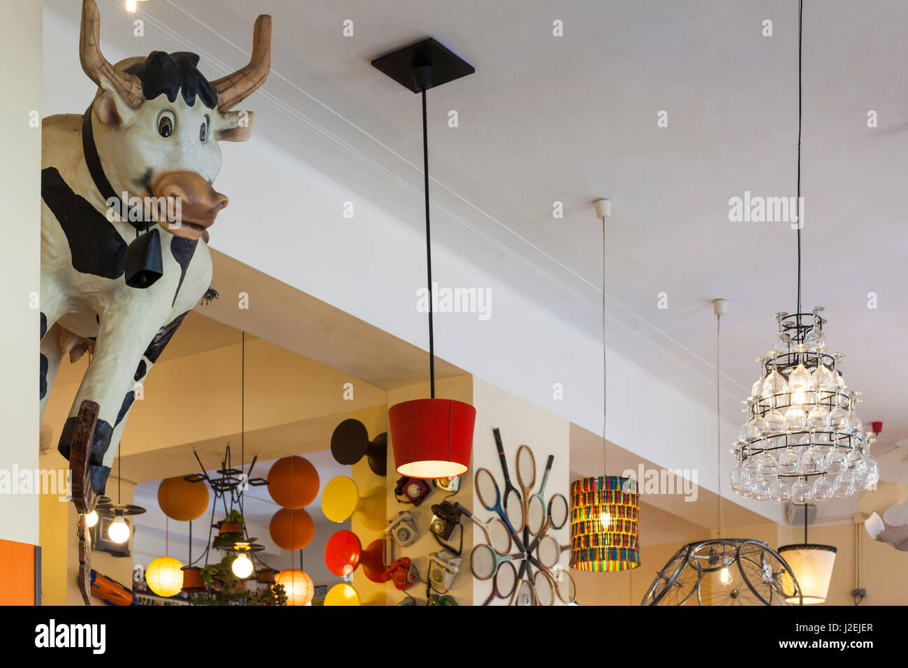 Romania, Crisana Region, Oradea, Lactobar, retro bistro restaurant, interior with cow art Stock Photo