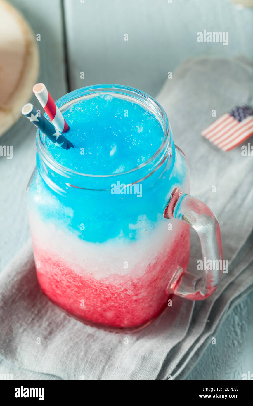 Homemade Patriotic Red White and Blue Slushie Cocktail with Vodka Stock Photo