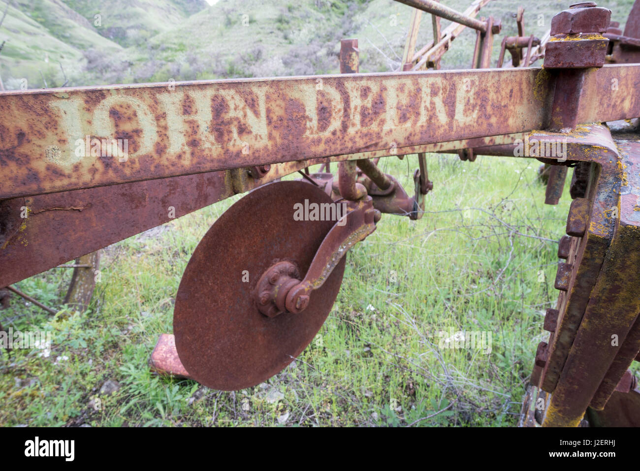 Old John Deere farm implement in Eastern Washington. Stock Photo