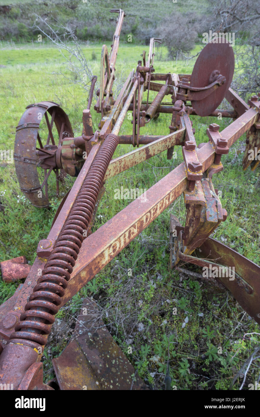 Old John Deere farm implement in Eastern Washington. Stock Photo