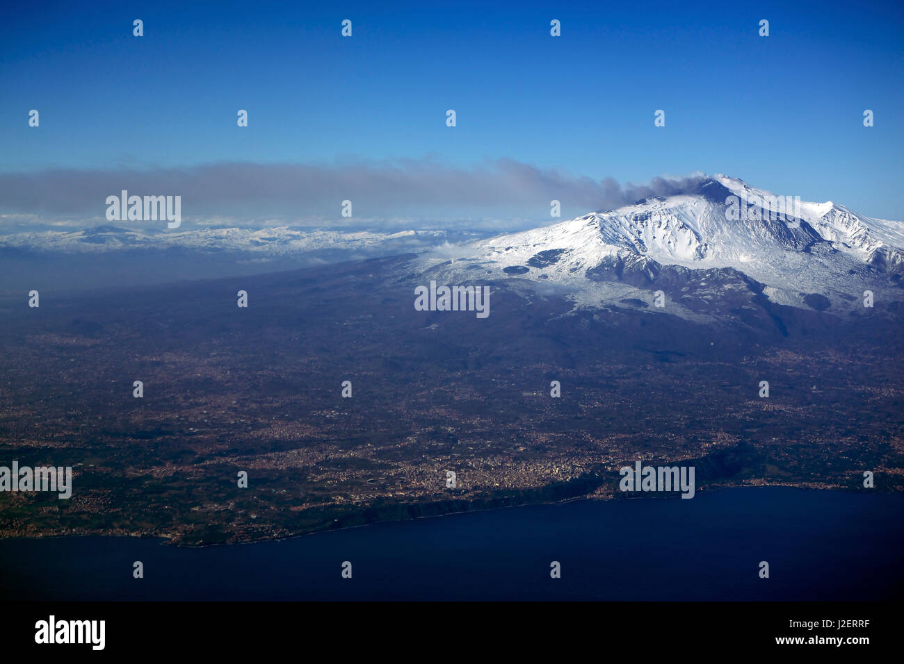 Italy, Sicily, aerial view of Mount Etna. City of Catania in the foreground. Coast on the Ionian sea. Stock Photo