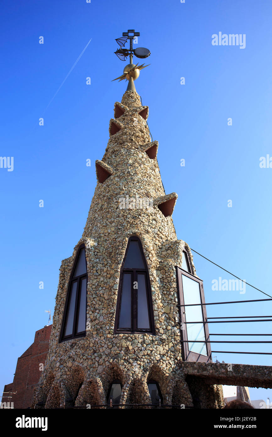 A precursor to Casa Mila, Palau Guell is also famous for its unusually shaped chimneys, designed by Antoni Gaudi in Barcelona, Spain. Stock Photo
