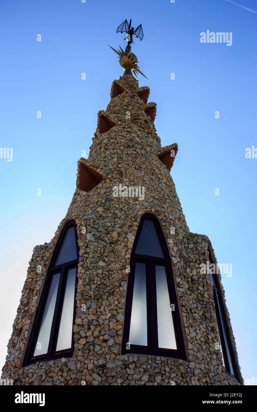 A precursor to Casa Mila, Palau Guell is also famous for its unusually shaped chimneys, designed by Antoni Gaudi in Barcelona, Spain. Stock Photo