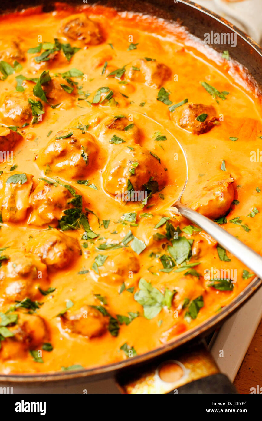 Herring fish balls in tomato and coconut milk sauce Stock Photo Alamy