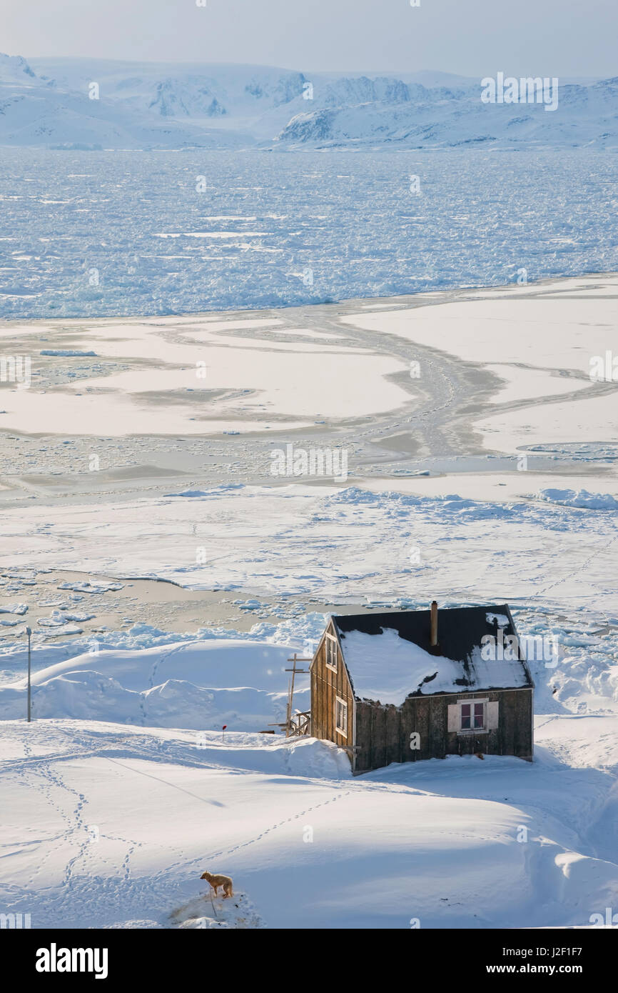 Tiniteqilaq and sea ice in winter, E. Greenland Stock Photo