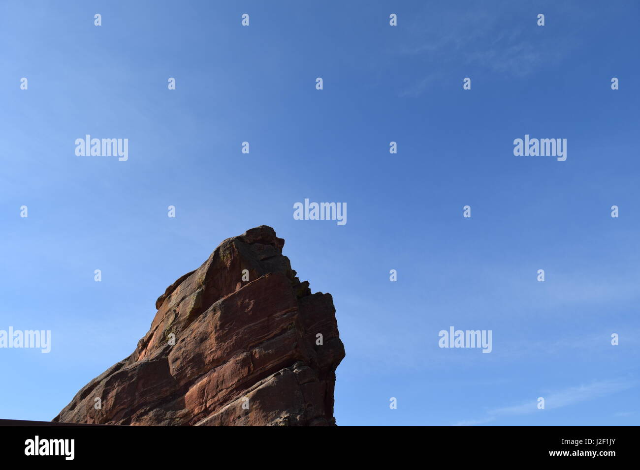 A glimpse of the peak of a red rock from the Red Rocks Amphitheater. Stock Photo