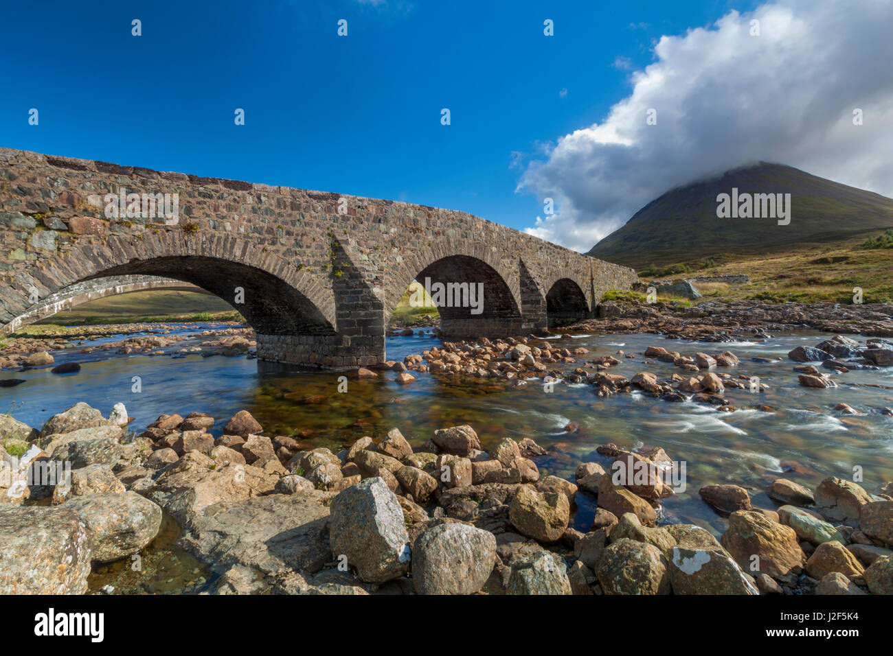 The Sligachan Bridge is a historic landmark and tourist attraction or the Isle of Skye in Scotland. From the bridge you have a good view of the black Cuillins mountains Stock Photo