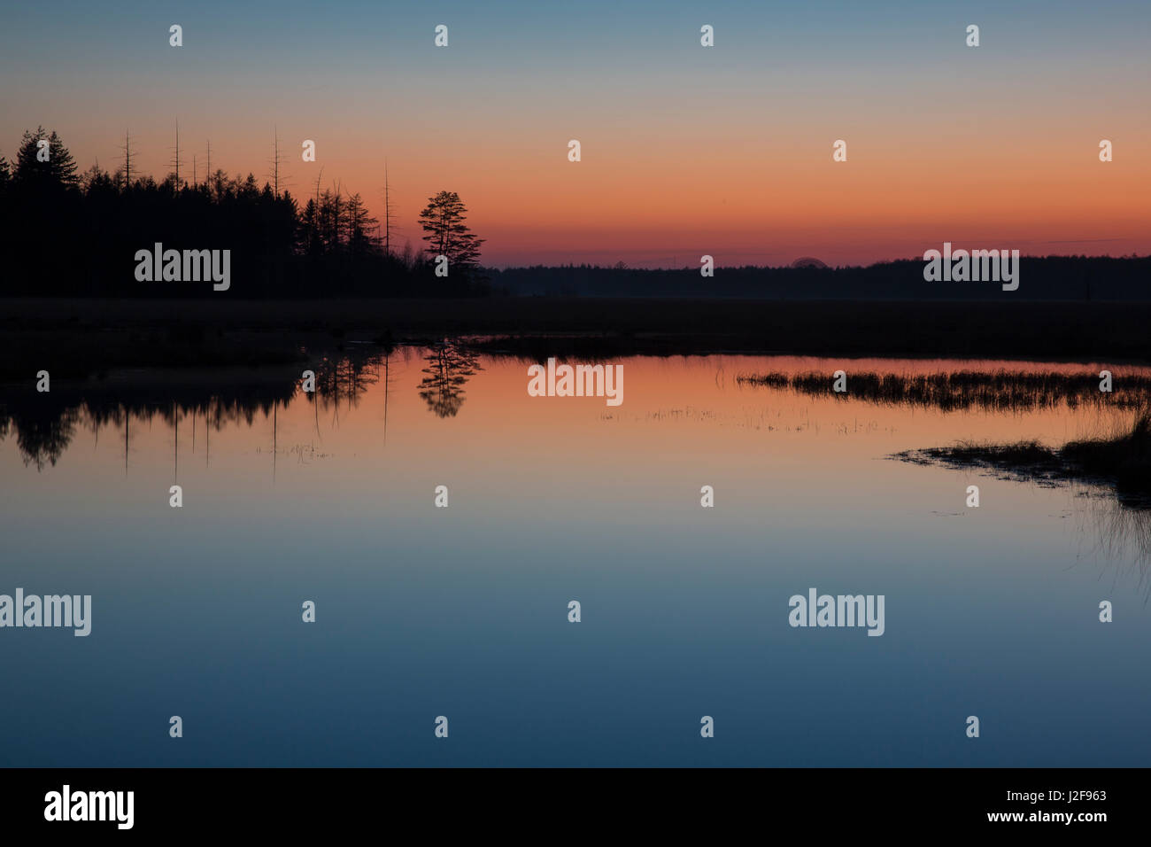 The sunset reflects in the water Stock Photo - Alamy
