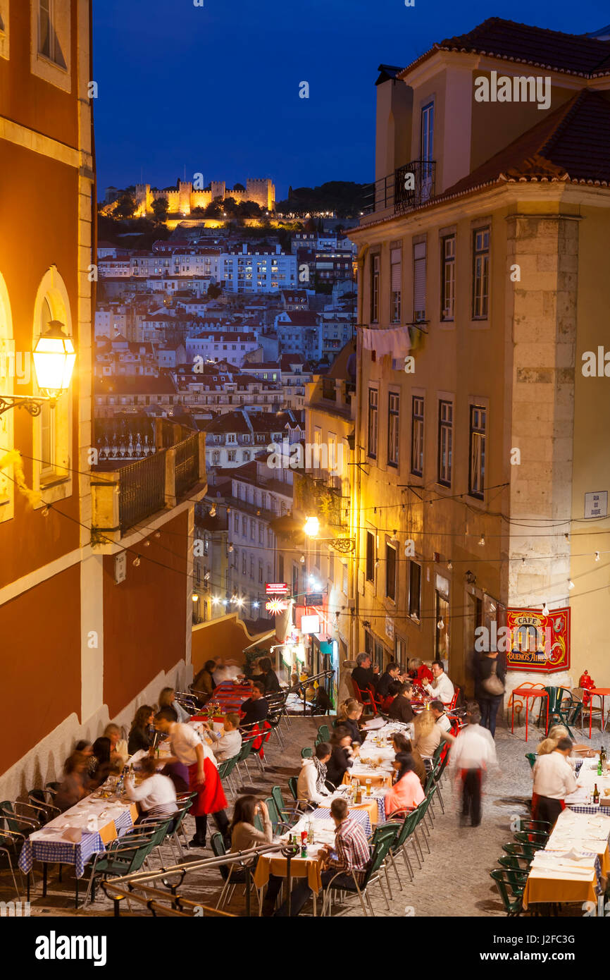 Restaurants in the Calcada do Duque, Bairro Alto district, looking towards castle Castelo Sao Jorge, Lisbon, Portugal Stock Photo