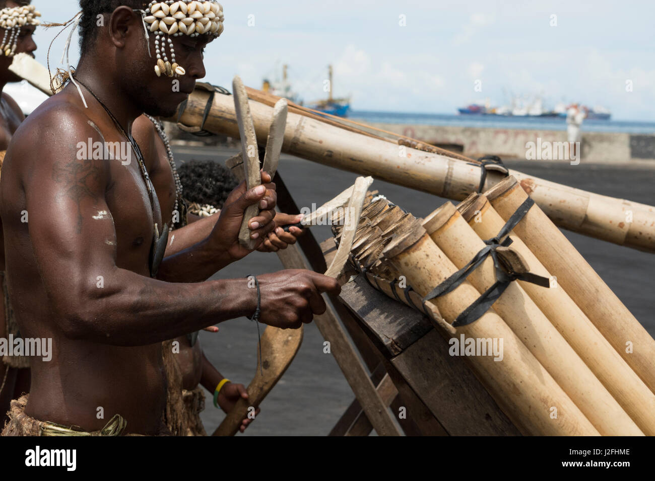 Melanesia, Solomon Islands, Guadalcanal Island, capital city of Honiara. Village welcome band with traditional wooden instruments. Stock Photo