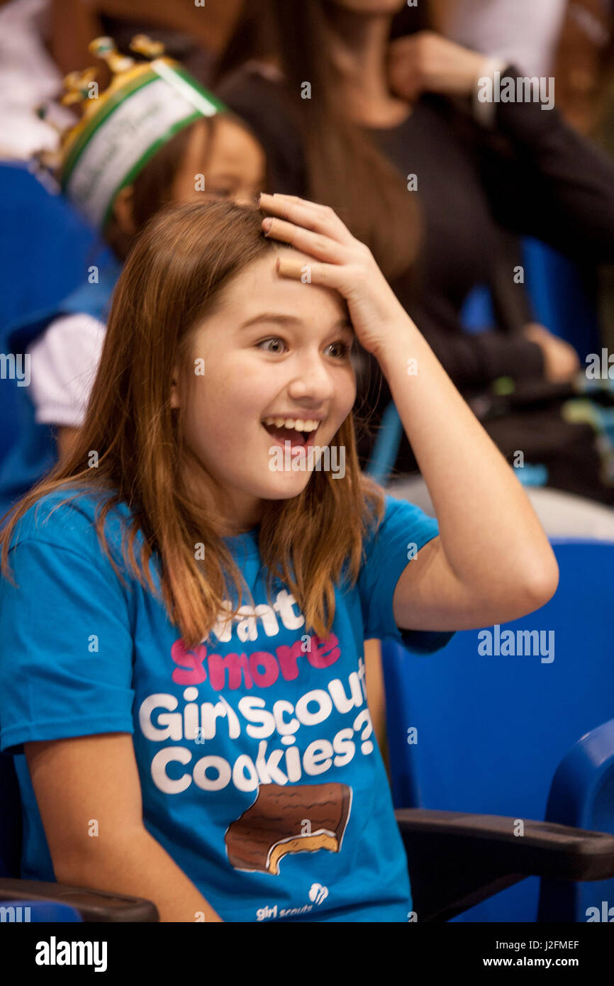 Wearing a Girl Scout cookie Tshirt, a 10yearold Girl Scout is amazed