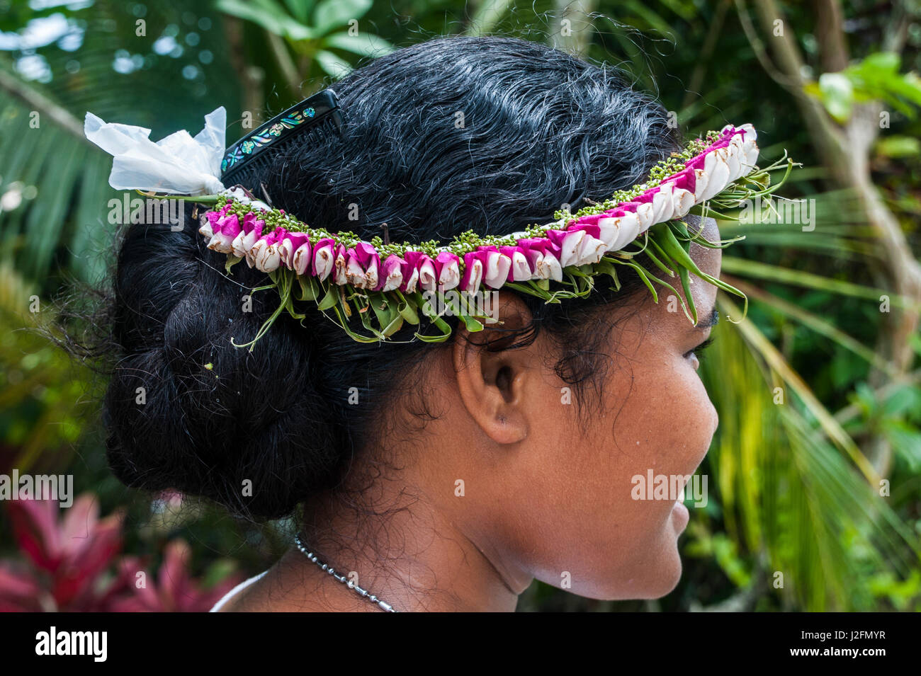Young girl with flowers in her hair, Island of Yap, Micronesia Stock Photo
