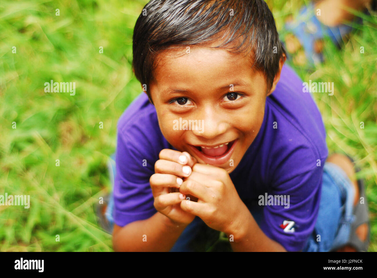 Belize, El Progreso, portrait of smiling boy at school Stock Photo