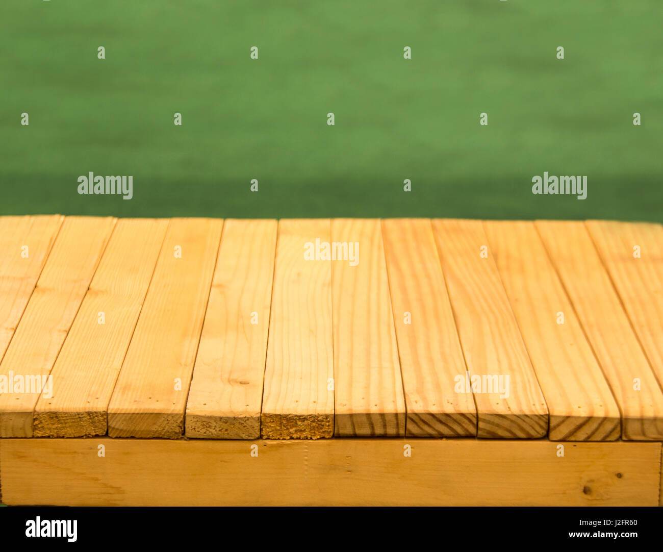 yellow wood table top and green background for display object Stock