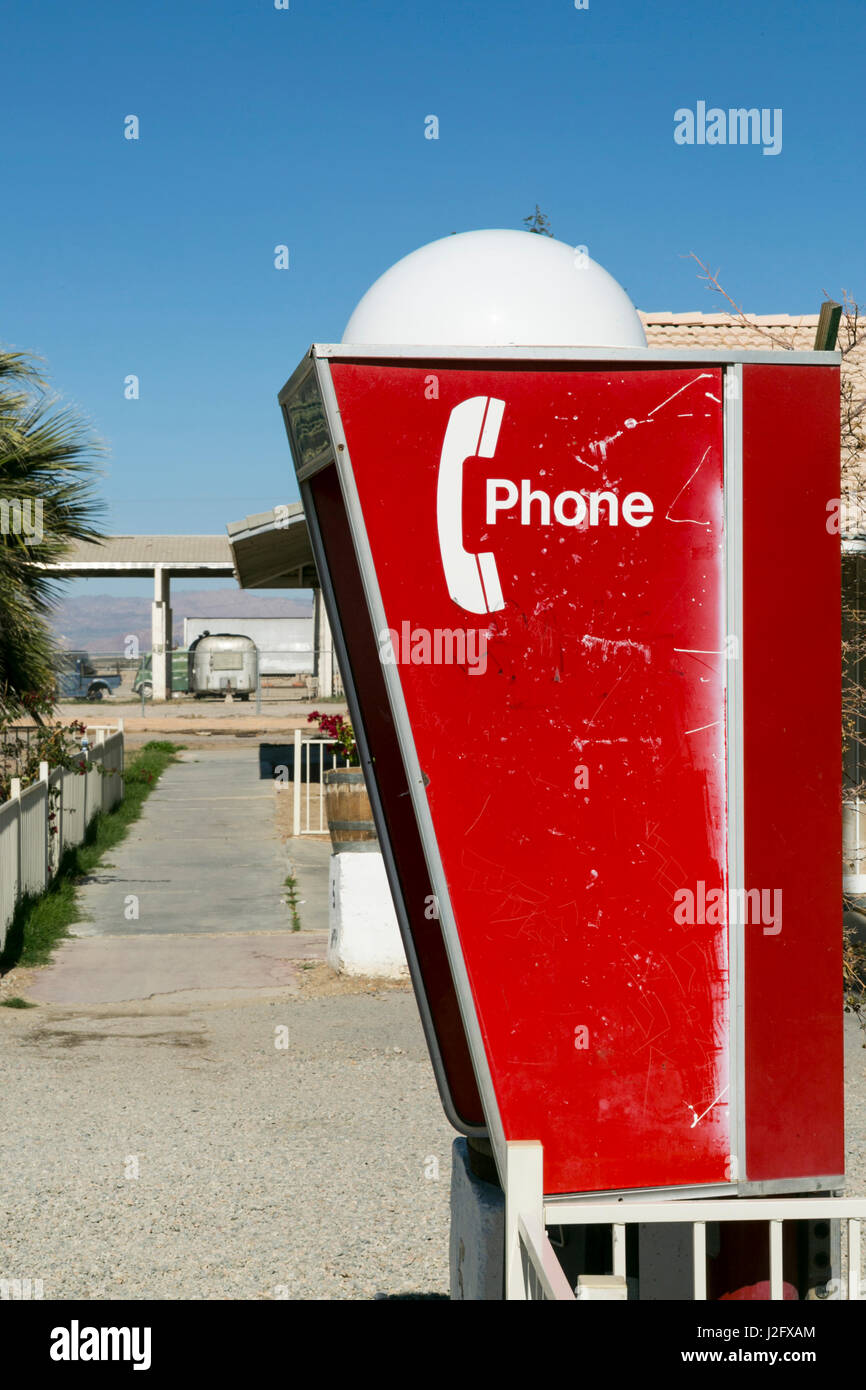 Antiquated telephone booth outside a Motel. Niland, California, USA Stock Photo