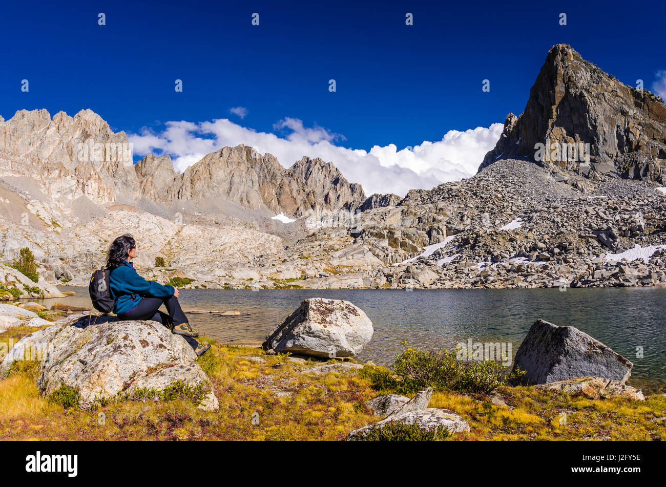 Hiker under Isosceles Peak and the Palisades in Dusy Basin, Kings Canyon National Park, Usa (MR) Stock Photo