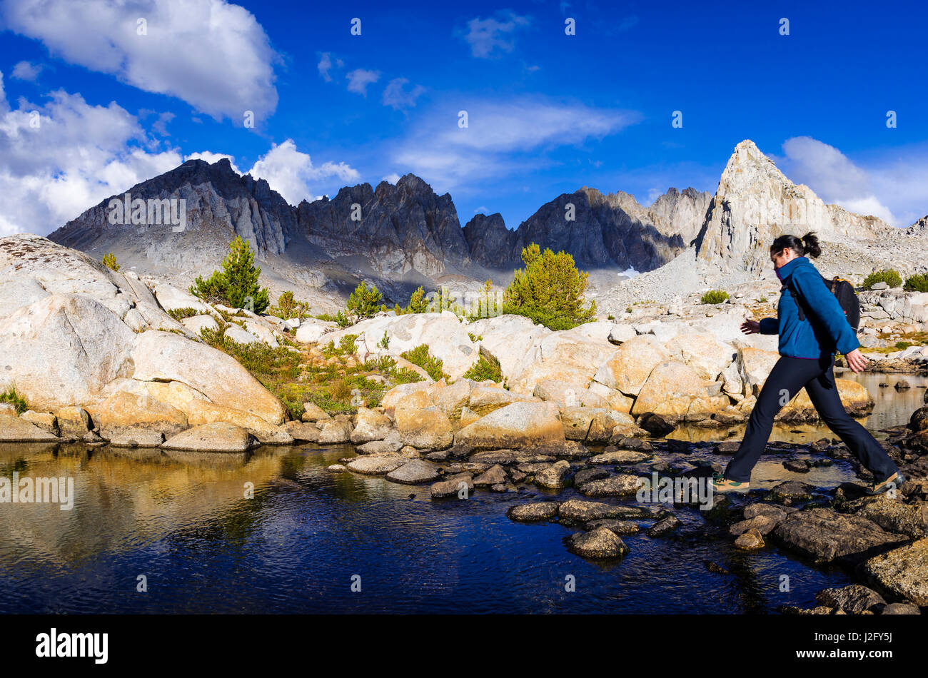 Hiker under Isosceles Peak and the Palisades in Dusy Basin, Kings Canyon National Park, Usa (MR) Stock Photo
