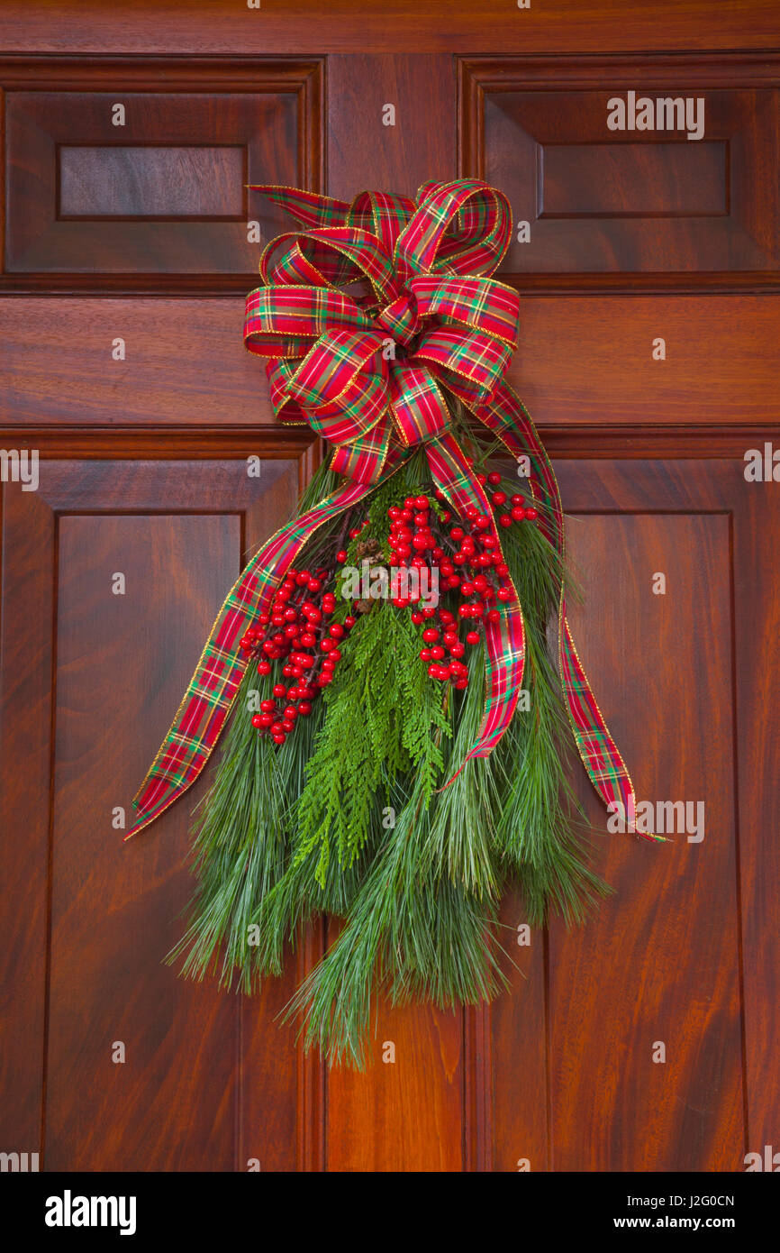 USA, Georgia, Savannah, Christmas decoration on beautiful wooden door. Stock Photo
