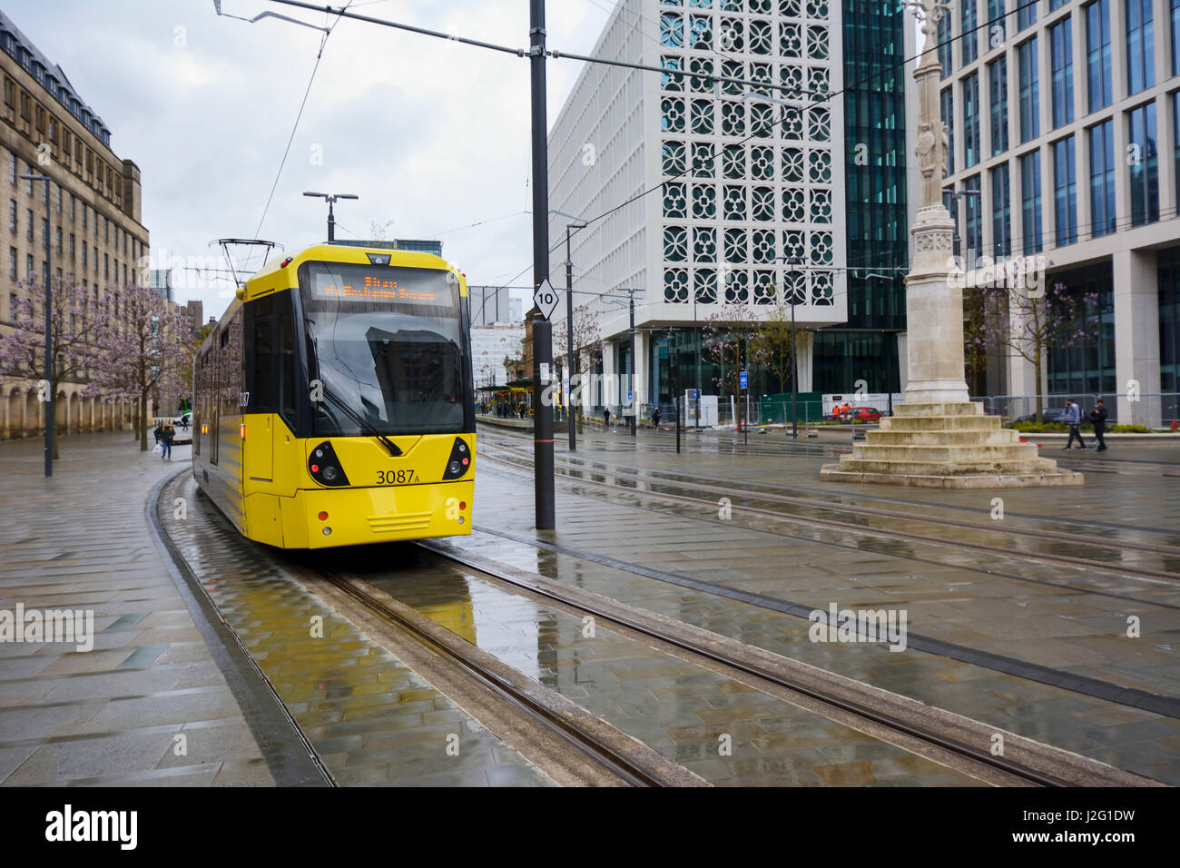 Metrolink light rail transport system entering St. Peters Square on a wet day in Manchester city centre. Stock Photo