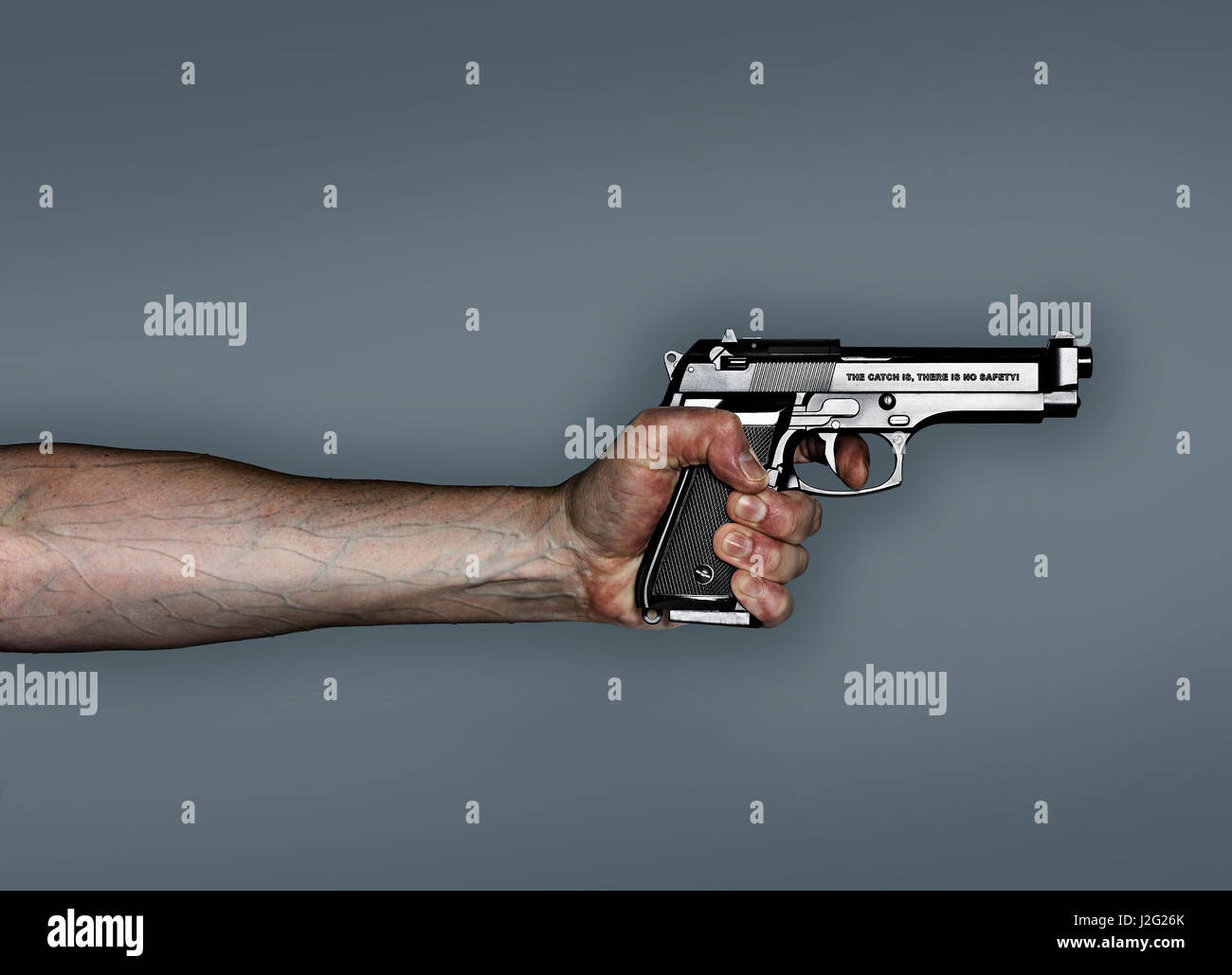 Hand holding pistol, anti gun campaign. The catch is, there is no safety, written on the side of the pistol Stock Photo