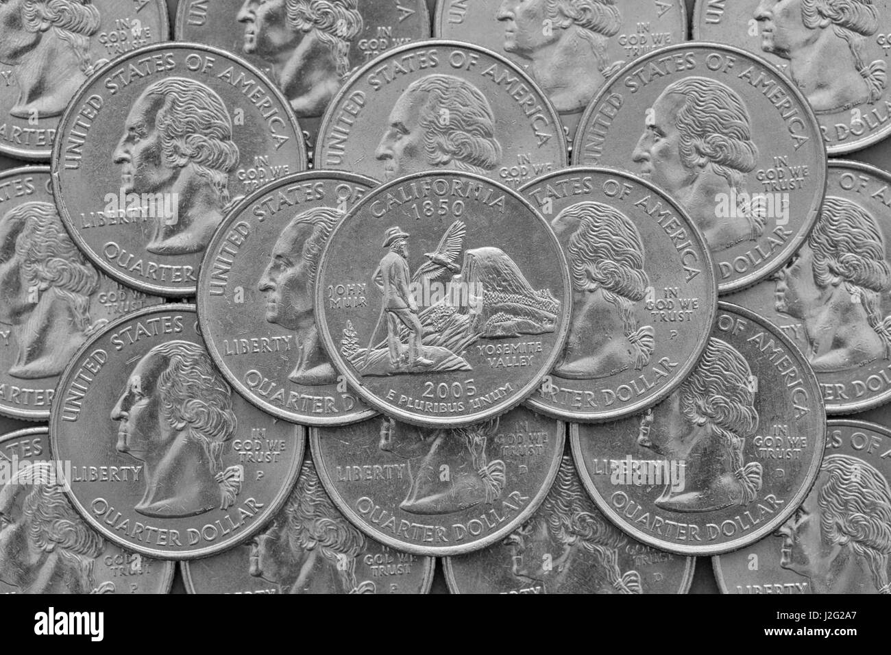 California state and coins of USA. Pile of the US quarter coins with George Washington and on the top a quarter of California State. Stock Photo