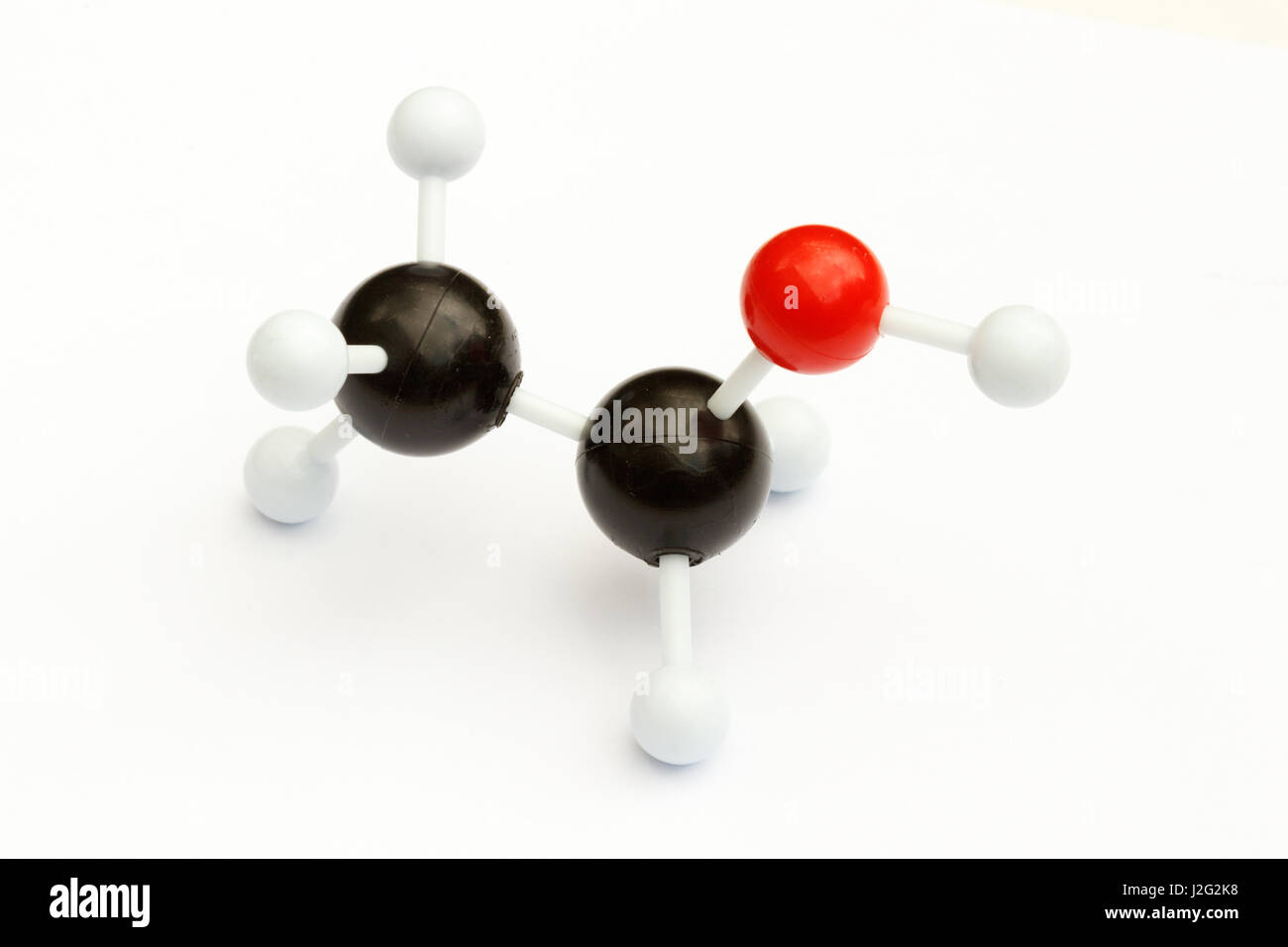 Plastic ball and stick model of an alcohol (ethanol, C2H5OH) molecule on a white background. Stock Photo