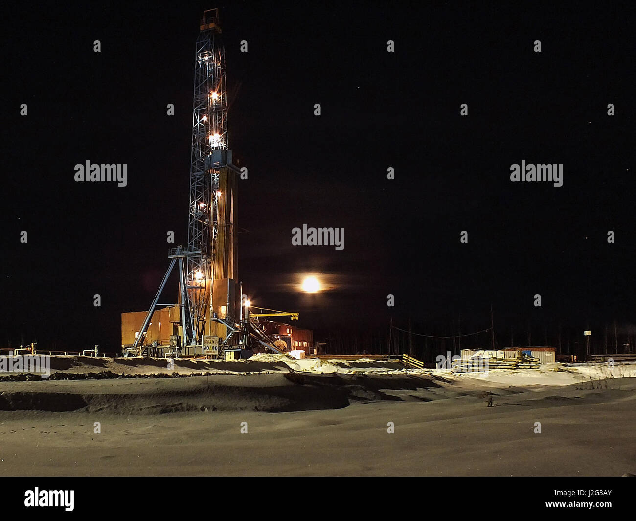Mobile drilling rig. Night full moon. Stock Photo