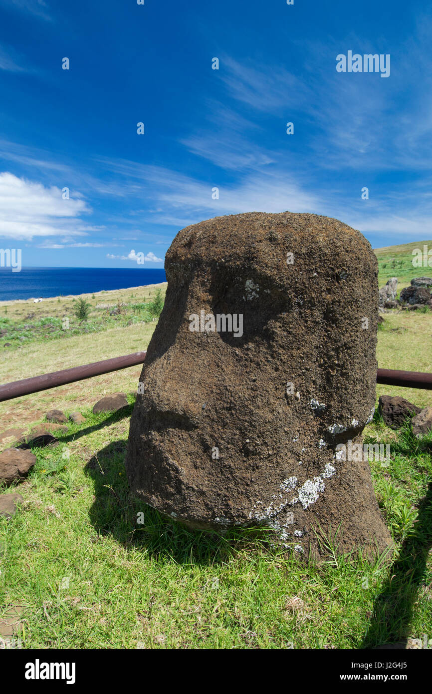 Chile, Easter Island aka Rapa Nui, Rapa Nui NP, Vinapu. Ahu Tahira important ceremonial platform with fitted slabs of basalt seen nowhere else in Polynesia. Moi head in back of ahu. Stock Photo