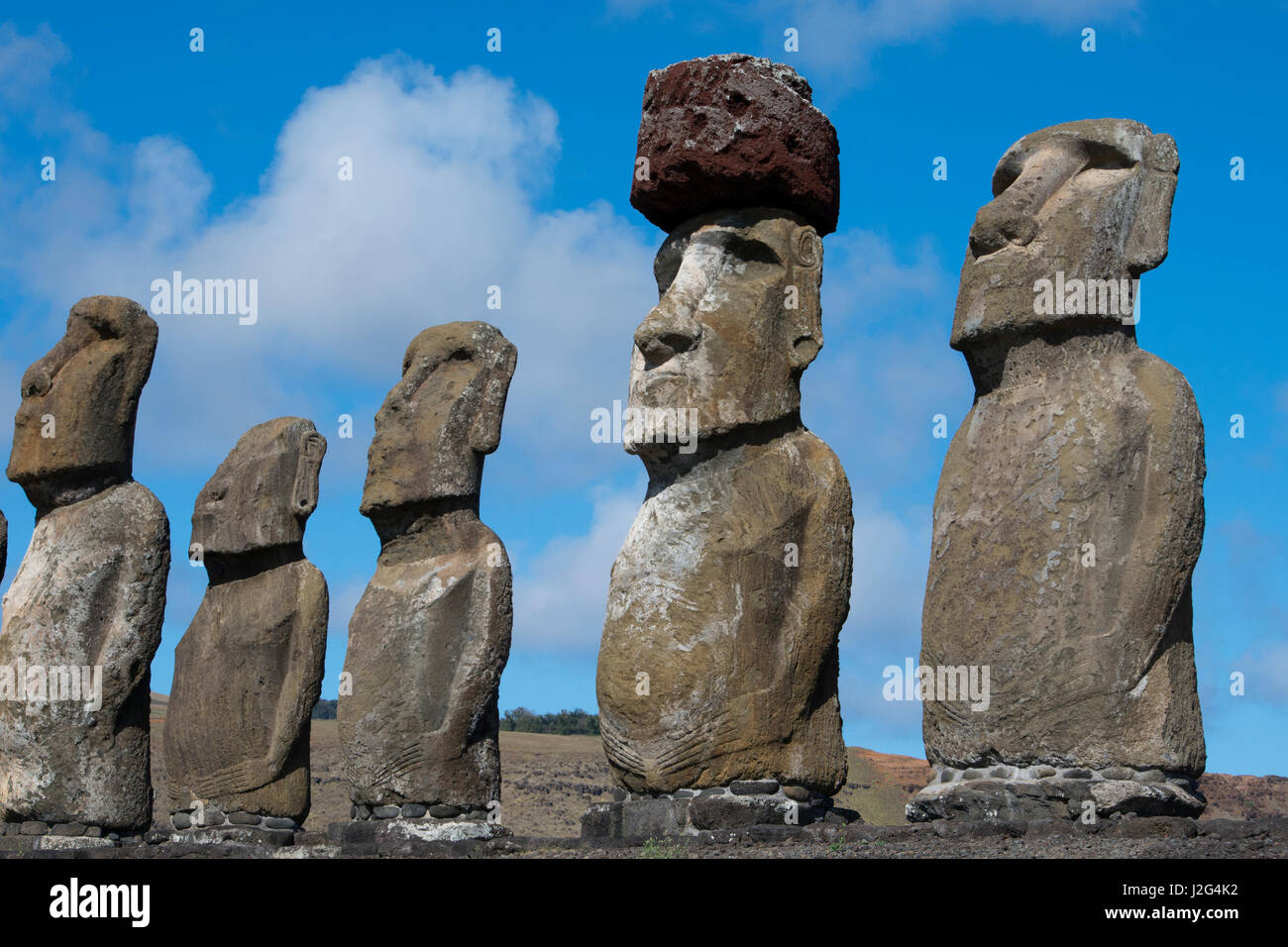 Chile, Easter Island, Hanga Nui. Rapa Nui National Park, Ahu Tongariki. Fifteen large moi statues on the largest ceremonial platform in all of Polynesia. Moi with pukao (headdress). Stock Photo