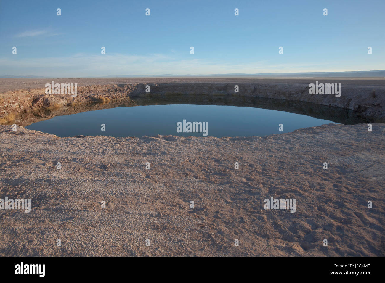 Eleven miles outside of San Pedro de Atacama, is Cejar, a series of three ponds located in the middle of the Salt Lake. Stock Photo