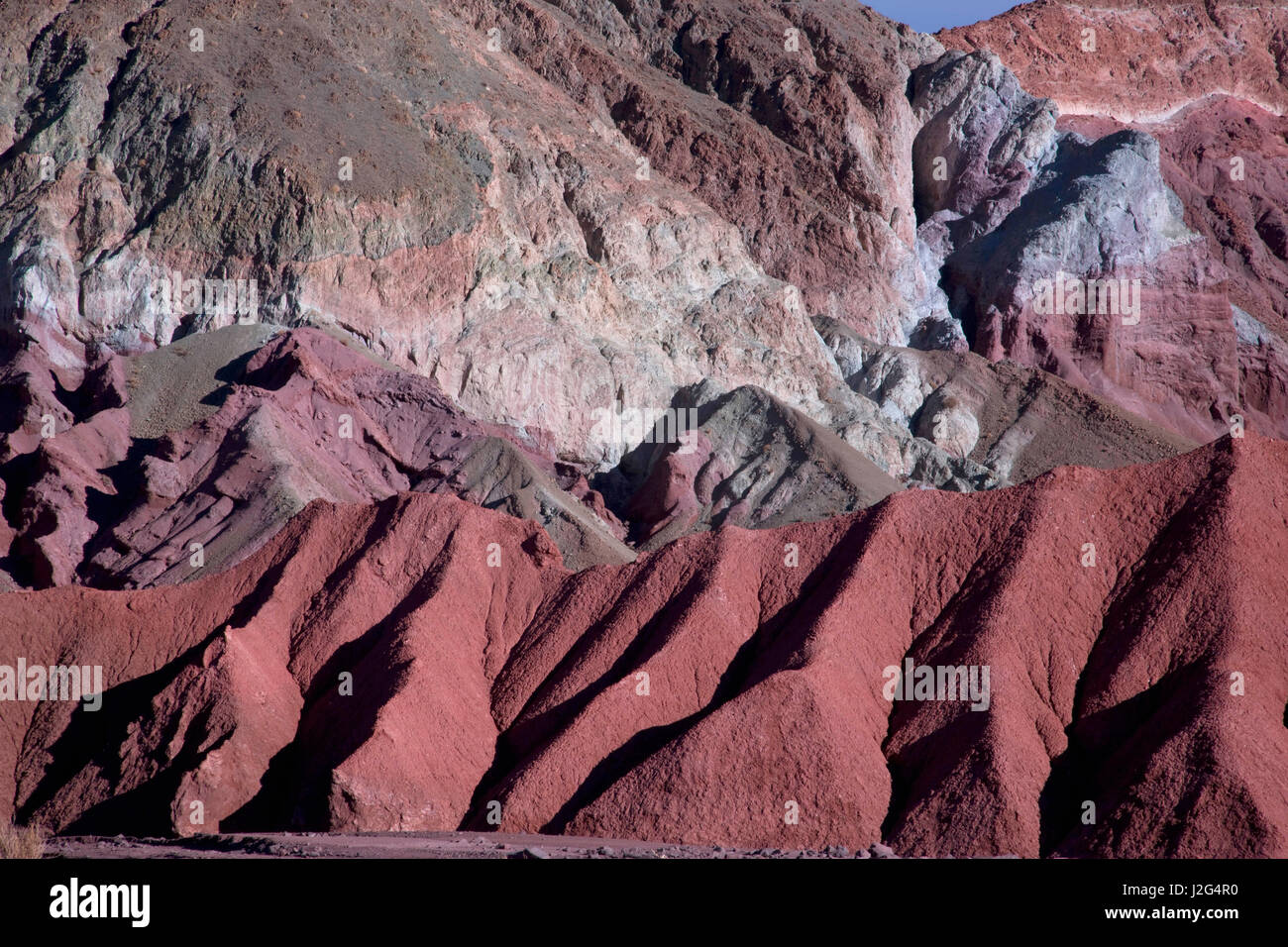 Located in the Domeyko Mountains in the Atacama desert outside of San Pedro are these bright multi-colored, mineral rich rock formations. Stock Photo