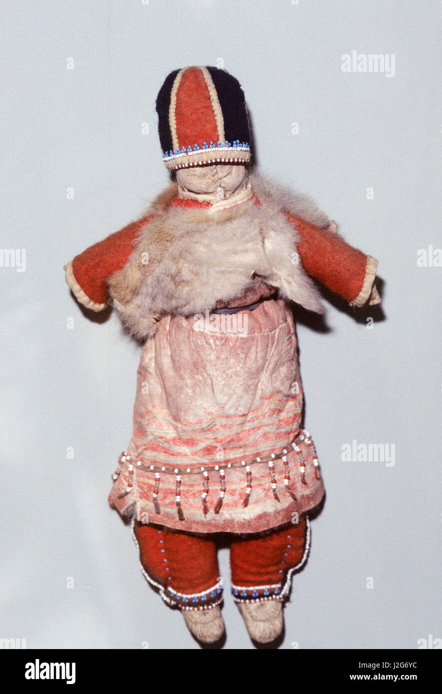 Native American Athabaskan artifact of a doll in traditional clothing that shows Russian influence. Alaska Stock Photo
