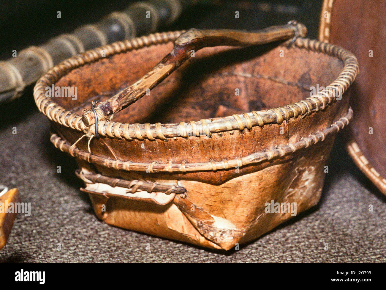 Gathering basket with handle made from birch bark used by the Athabaskan Indians of Alaska Stock Photo