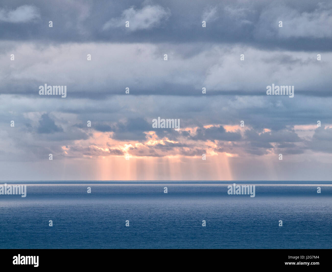 USA, California, San Diego. Sun's rays break through clouds over Pacific Ocean Stock Photo